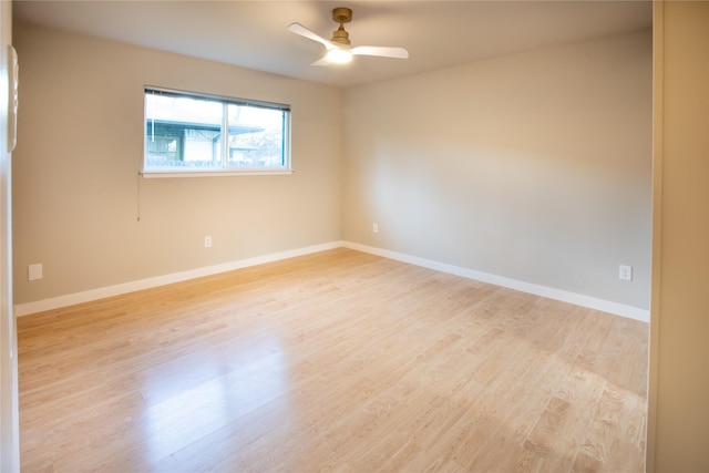 spare room featuring ceiling fan and light hardwood / wood-style flooring