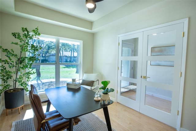 office with french doors and light wood-type flooring