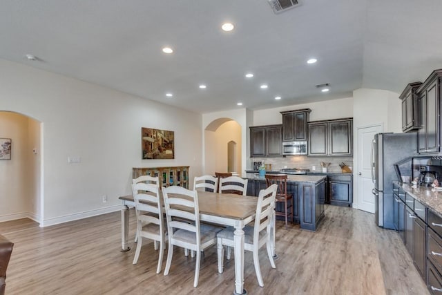 dining space featuring light hardwood / wood-style floors