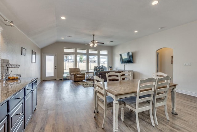 dining room featuring wood-type flooring and ceiling fan