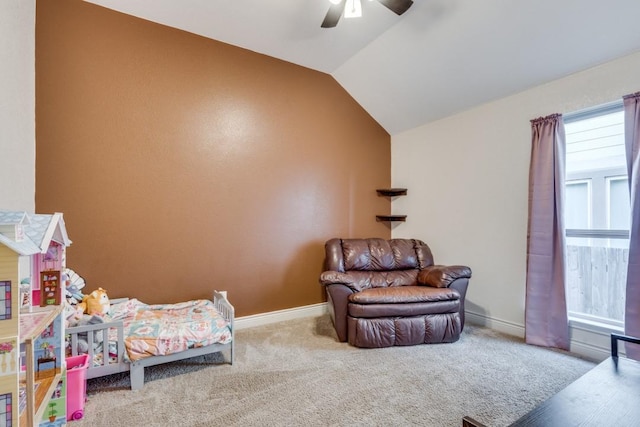 carpeted bedroom with vaulted ceiling and ceiling fan