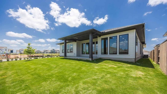 8612 Ambergill Ct, Austin, TX 78744 - back of house featuring a fenced backyard and a patio area