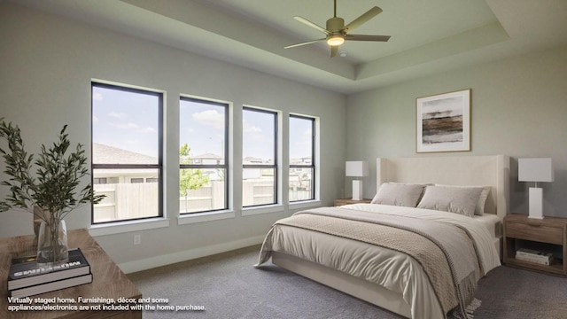 8612 Ambergill Ct, Austin, TX 78744 - carpeted bedroom featuring a raised ceiling and a ceiling fan