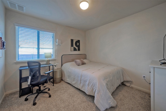 bedroom featuring light colored carpet