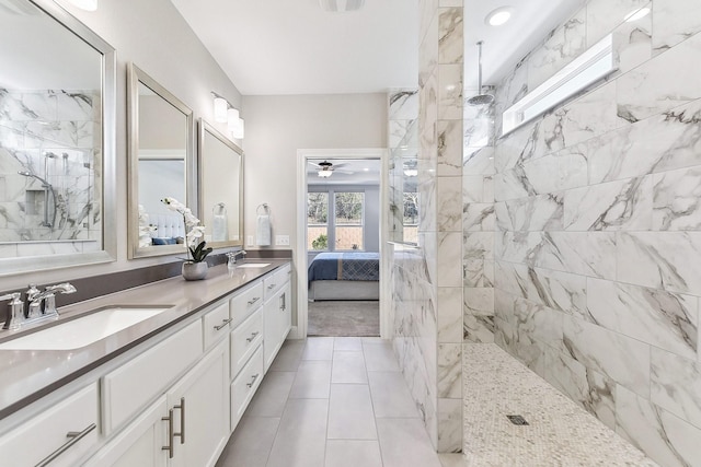 bathroom featuring vanity, tile patterned floors, and a shower