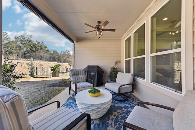 view of patio featuring ceiling fan