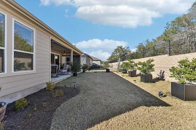 view of yard with ceiling fan