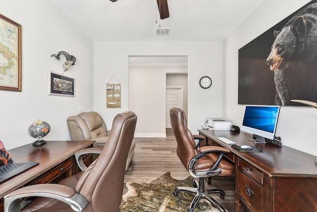 office space with light hardwood / wood-style flooring and ceiling fan