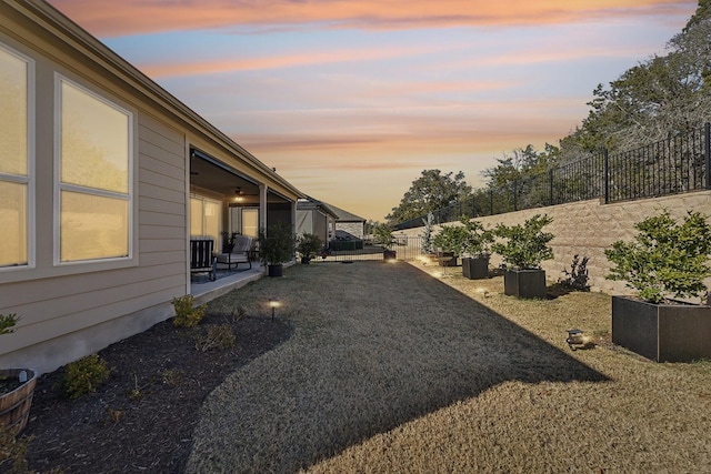 view of yard at dusk