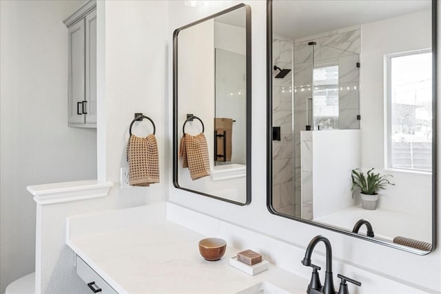 bathroom with vanity and an enclosed shower