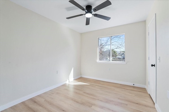 spare room featuring ceiling fan and light wood-type flooring