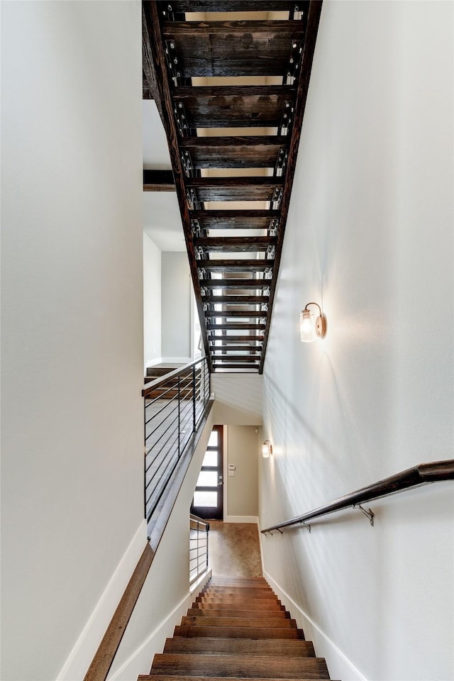 staircase featuring hardwood / wood-style floors