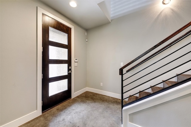 foyer entrance with carpet floors