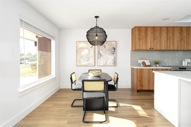 dining space with light wood-type flooring