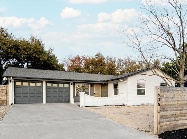 ranch-style home with a garage