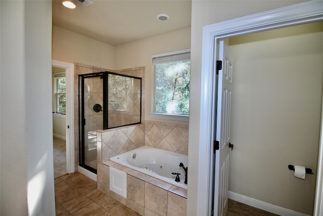 bathroom featuring tile patterned floors and plus walk in shower