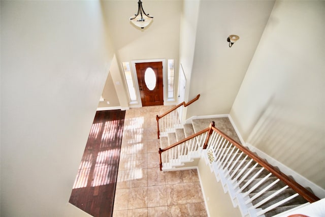 foyer entrance with a high ceiling