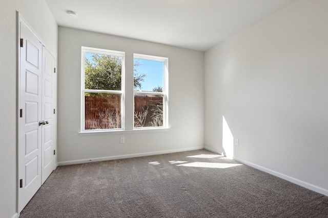 unfurnished room featuring carpet floors