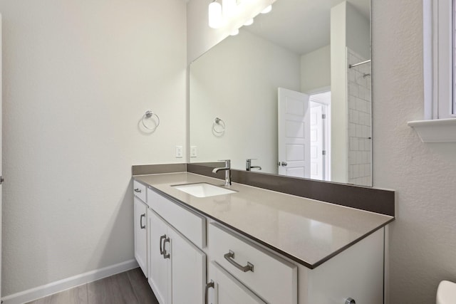 bathroom featuring vanity and wood-type flooring