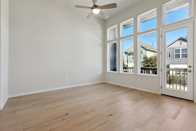 spare room featuring ceiling fan and light wood-type flooring