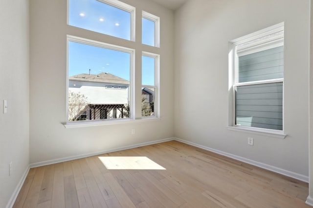 spare room with light wood-type flooring