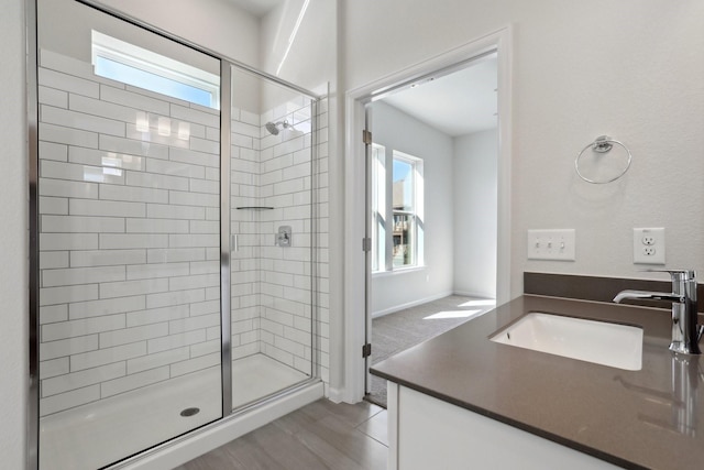 bathroom with vanity and an enclosed shower