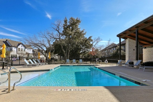 view of swimming pool with a patio