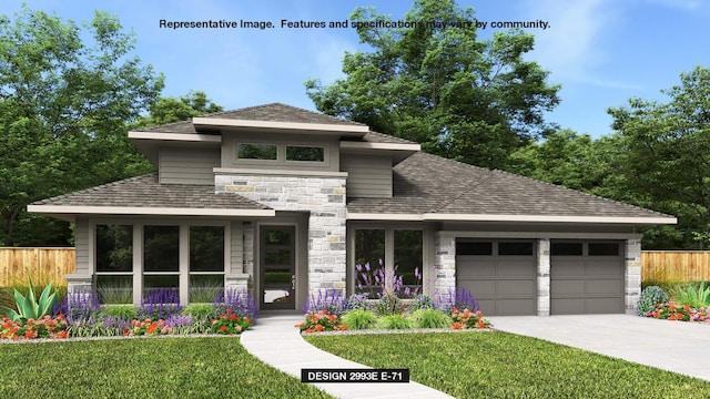 prairie-style home with a garage and a front lawn