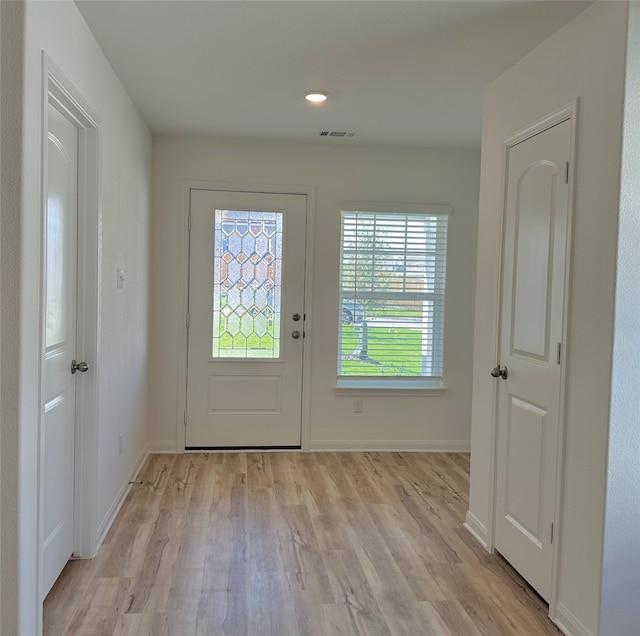 doorway to outside with light hardwood / wood-style floors