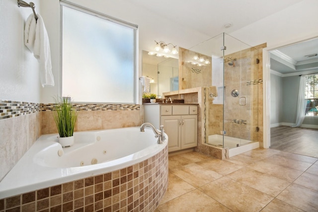 bathroom with vanity, ornamental molding, and separate shower and tub