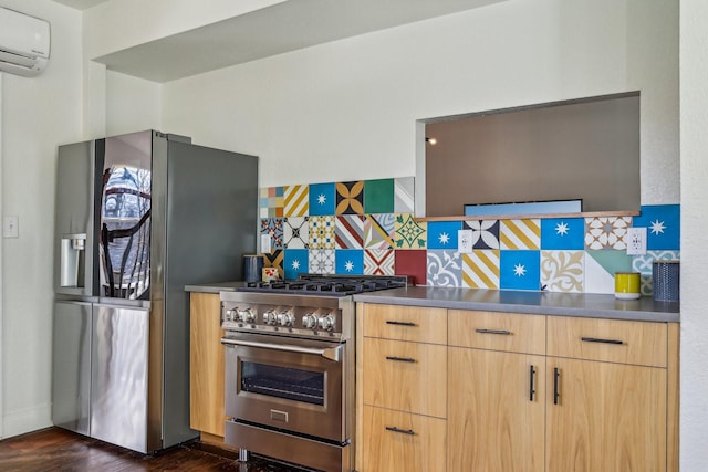 kitchen featuring an AC wall unit, light brown cabinetry, dark hardwood / wood-style flooring, decorative backsplash, and stainless steel appliances