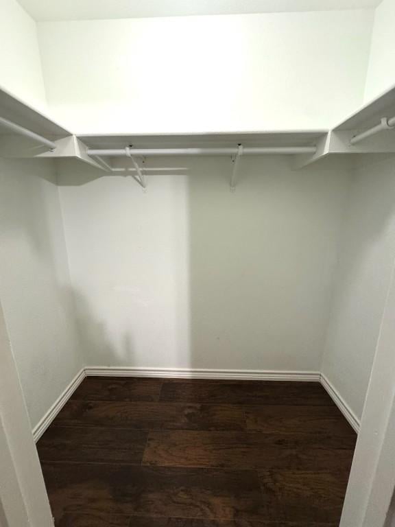 201 Windridge Dr N, Lockhart, TX 78644 - spacious closet with dark wood-type flooring