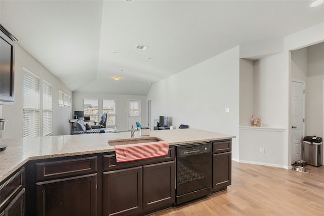 kitchen with light hardwood / wood-style flooring, dishwasher, light stone counters, vaulted ceiling, and kitchen peninsula