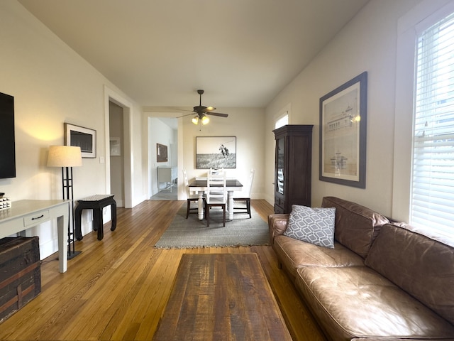 living room with ceiling fan, a healthy amount of sunlight, and hardwood / wood-style floors