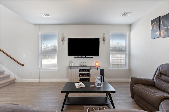 living room with light hardwood / wood-style flooring