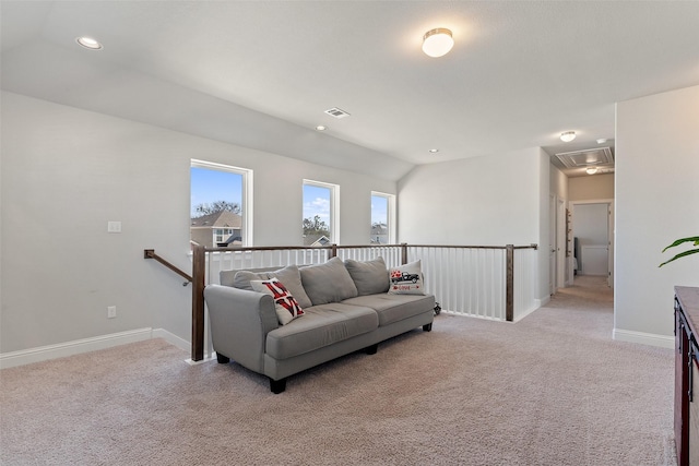 living room with lofted ceiling and light carpet