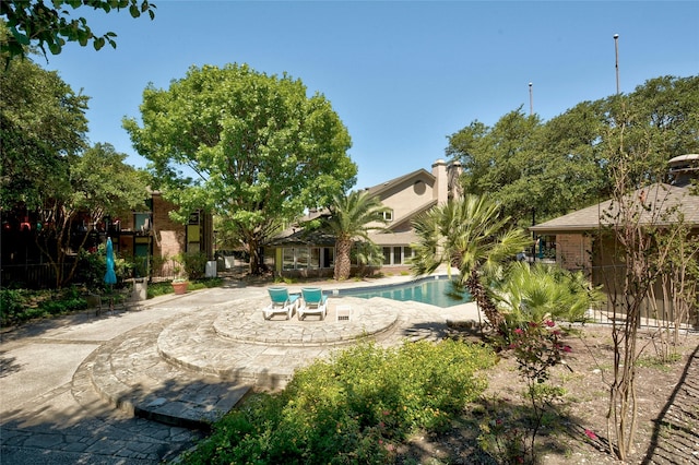 view of swimming pool with a patio area