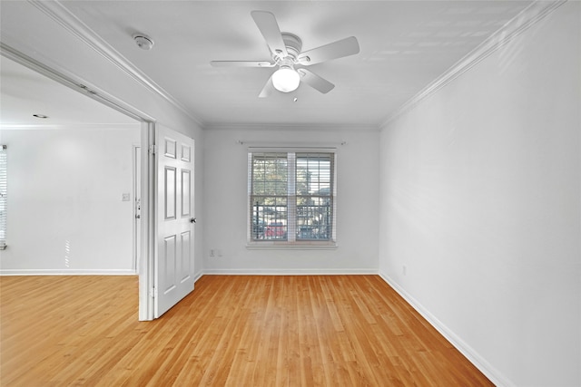 empty room with crown molding, ceiling fan, and light wood-type flooring