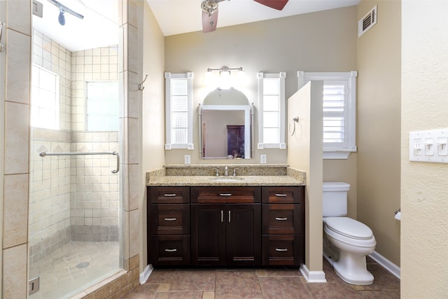 bathroom with lofted ceiling, ceiling fan, an enclosed shower, vanity, and toilet