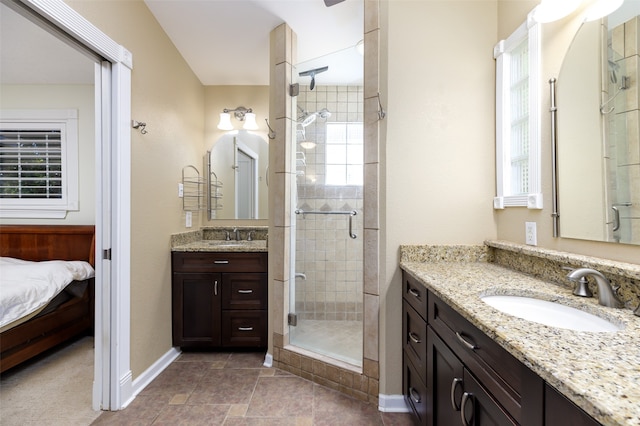 bathroom featuring vanity and a shower with shower door