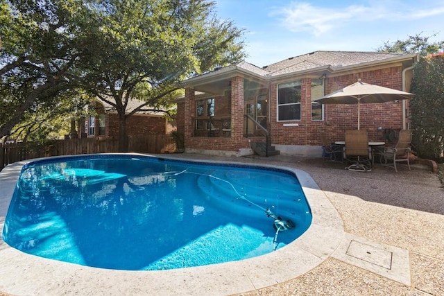 view of swimming pool featuring a patio area