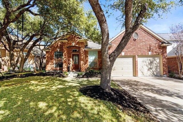 view of property with a garage and a front lawn