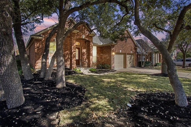 view of front facade with a garage and a yard