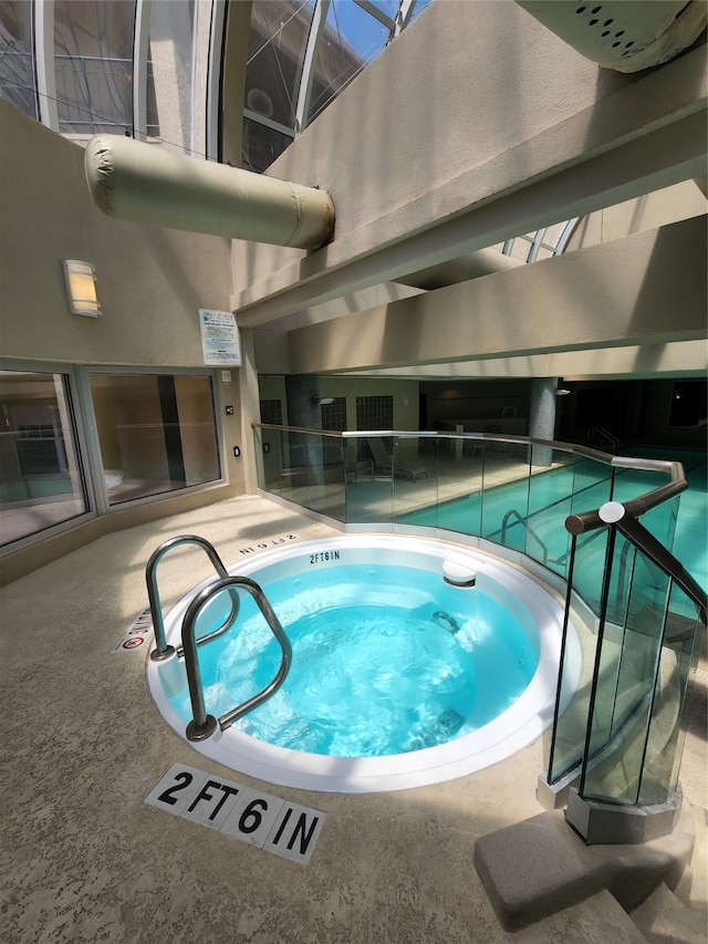 view of pool featuring an indoor hot tub