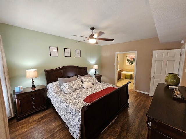 bedroom featuring dark wood-type flooring, ceiling fan, and ensuite bathroom