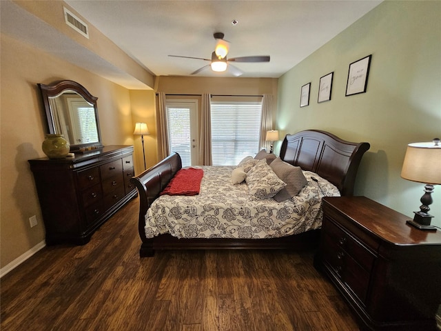 bedroom with dark wood-type flooring and ceiling fan