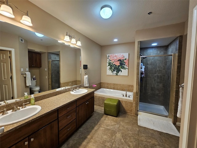 full bathroom featuring independent shower and bath, vanity, and toilet