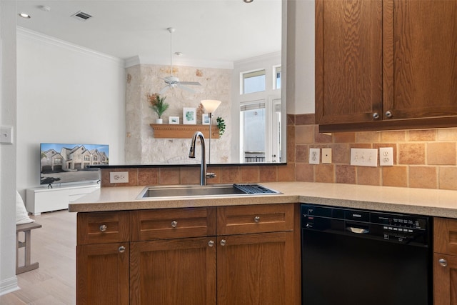 kitchen featuring sink, crown molding, dishwasher, light hardwood / wood-style floors, and kitchen peninsula