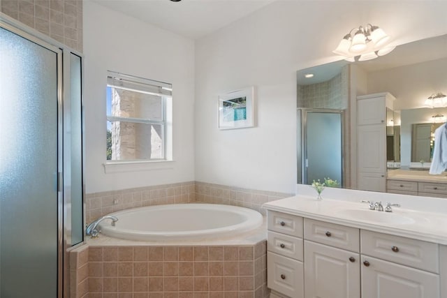 1701 Spyglass Dr Unit 11, Austin, TX 78746 - full bathroom with vanity, a garden tub, and a stall shower
