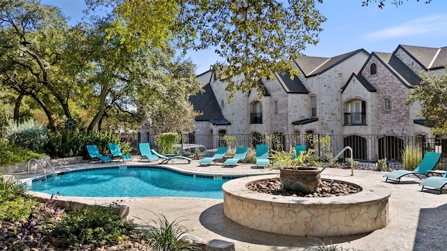 view of pool featuring a patio